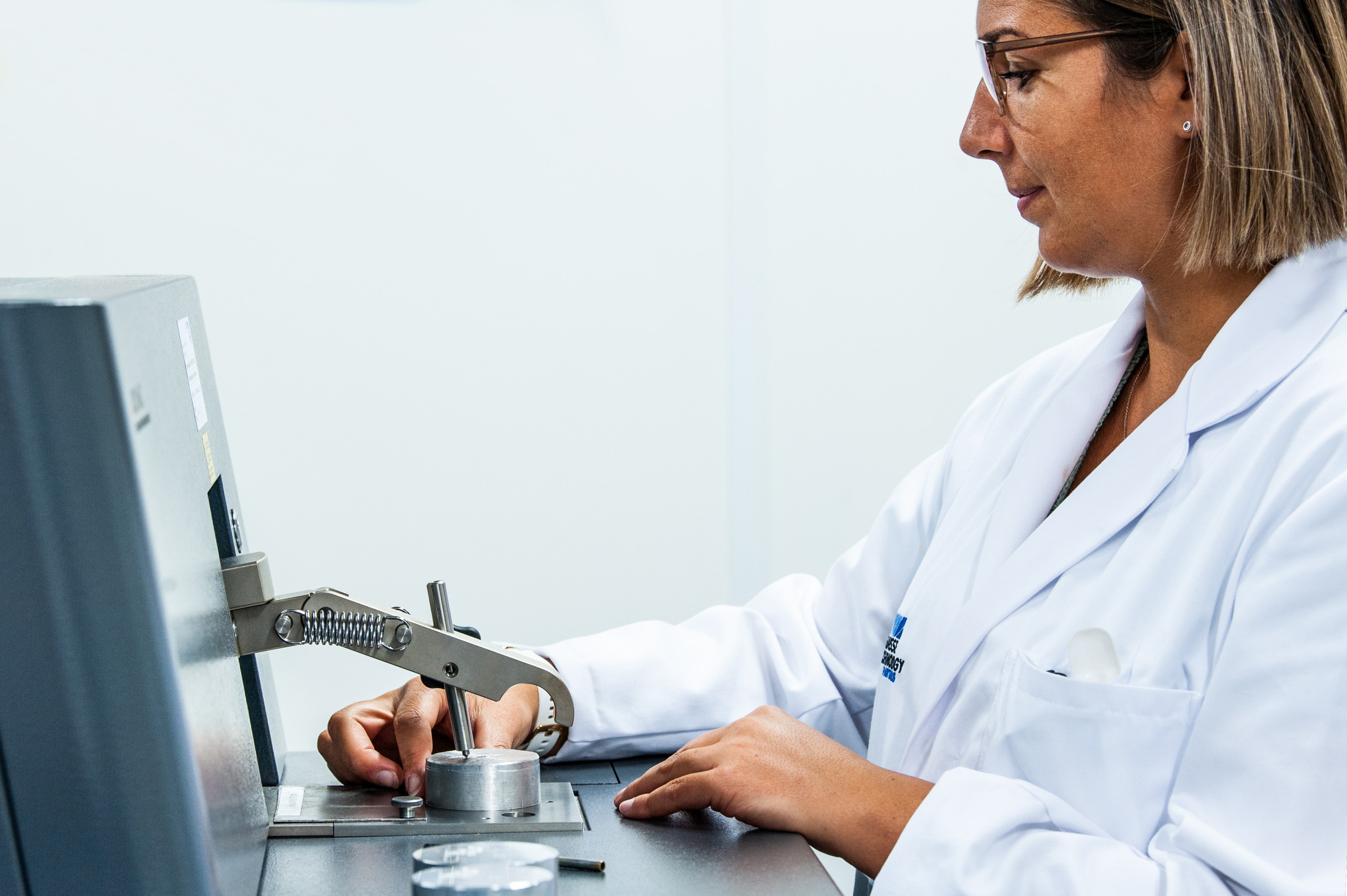 Lab technician with certified reference material Lab technician with certified reference material